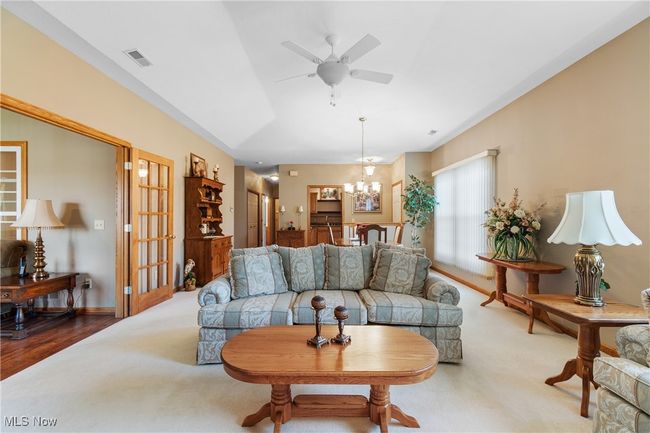 View from fireplace looking toward kitchen and entry. | Image 8