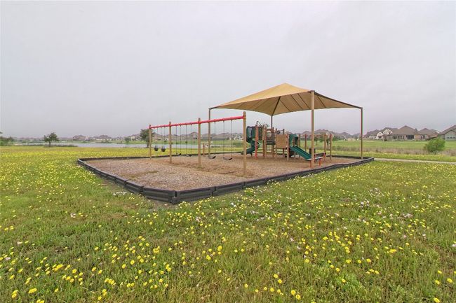 Community jungle gym featuring a yard | Image 39
