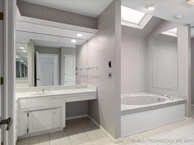 Bathroom 3 upstairs has double vanities, whirlpool | Image 43