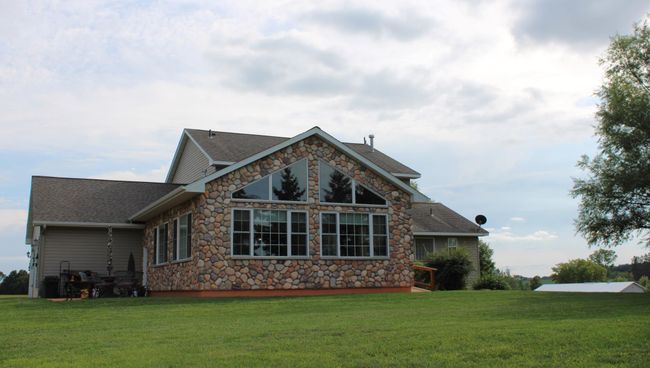 Back view of the sunroom from the back yard. | Image 4