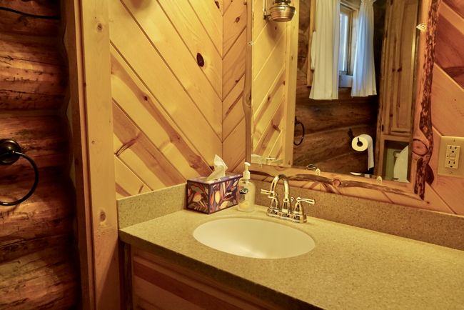 Bathroom featuring rustic walls and vanity | Image 32