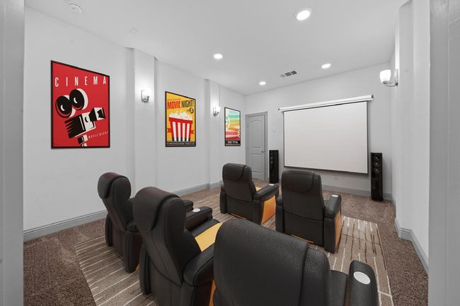 Carpeted home theater room featuring baseboards, visible vents, and recessed lighting | Image 17
