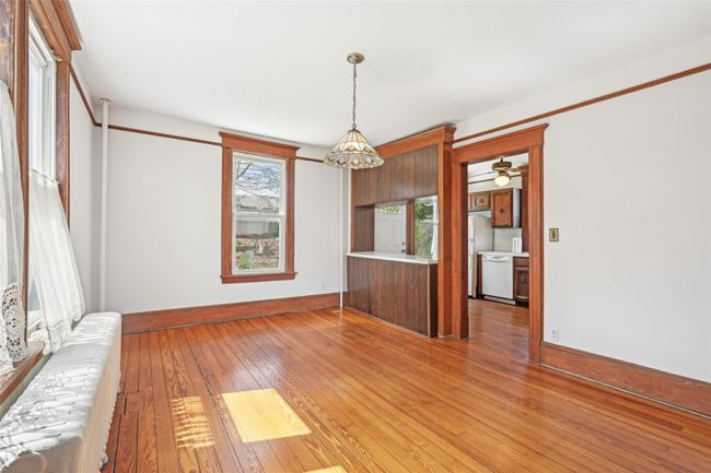 Empty room with baseboards and light wood-style floors | Image 10