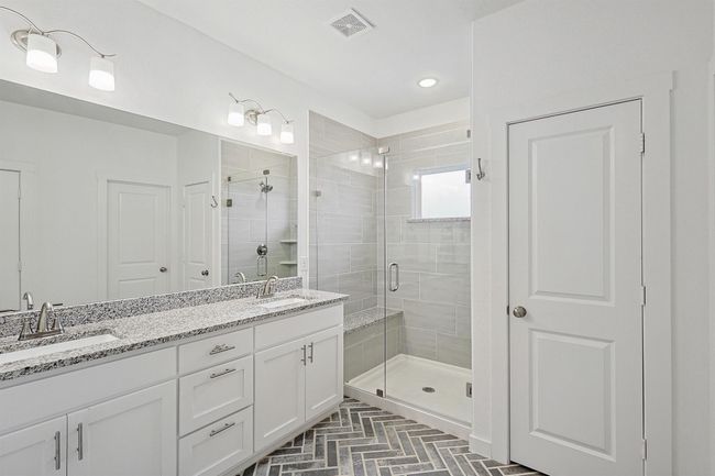 Dual sinks and a large walk-in shower with frameless door | Image 15