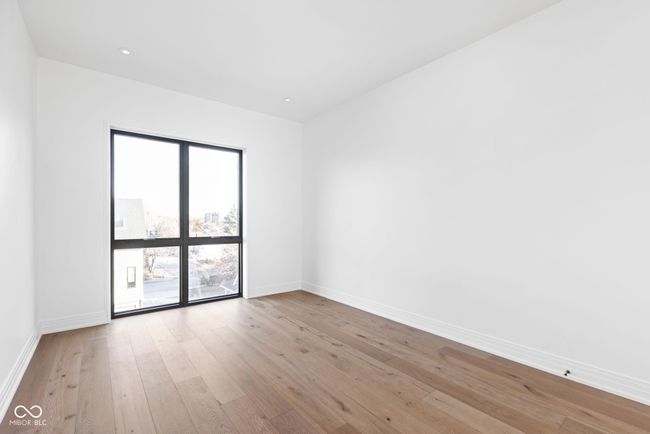 Primary bedroom with walk-in closet and 8ft floor length window | Image 26