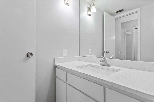 Bathroom featuring vanity and visible vents | Image 27