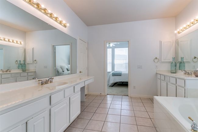 View from the bath room into the primary bedroom. | Image 16