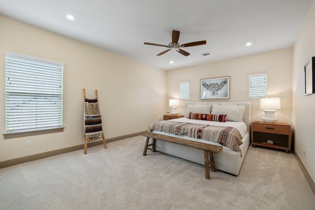 Carpeted bedroom with ceiling fan, baseboards, and recessed lighting | Image 25