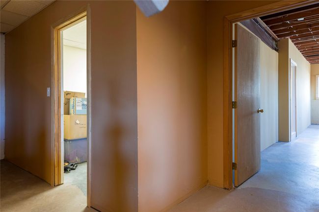 Corridor featuring concrete floors | Image 28