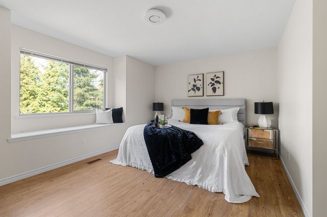 Bedroom featuring wood finished floors and baseboards | Image 18