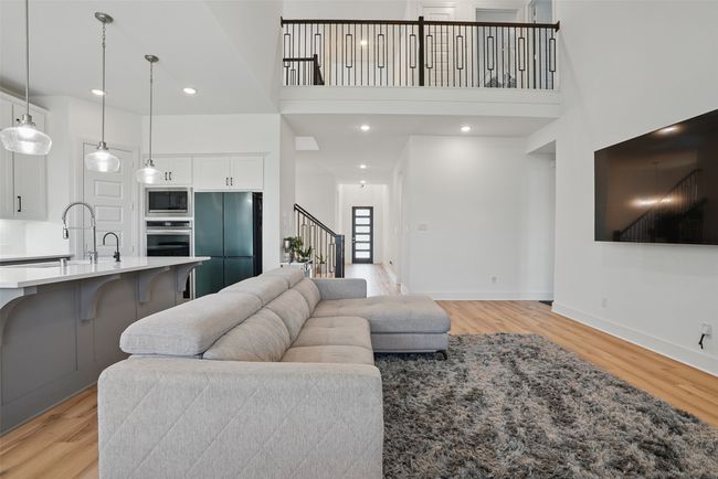 Open rail to loft overlooks living area | Image 6