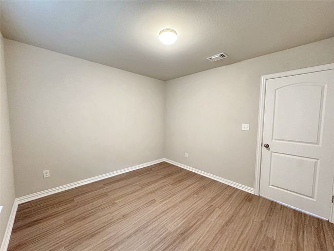 Unfurnished room with light wood-type flooring and baseboards | Image 10