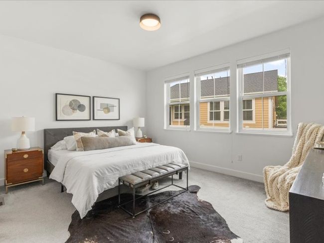 Bedroom with carpet and multiple windows | Image 8