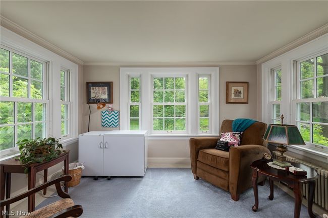 Sitting room featuring carpet floors, plenty of natural light, and crown molding | Image 31