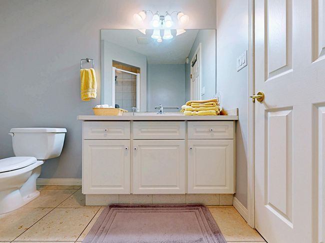 Bathroom featuring vanity and an enclosed shower | Image 34