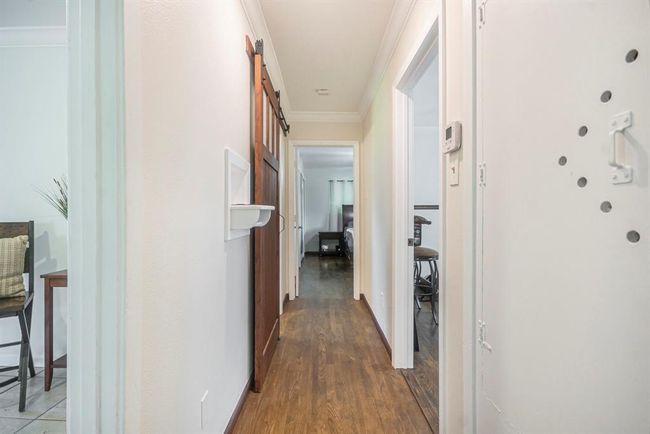 Home offers original hardwood floors throughout the hall and bedrooms. | Image 15