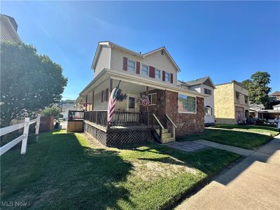 View of front of house featuring a front lawn and a porch | Image 3