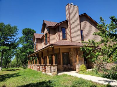 View of property exterior with a lawn | Image 2