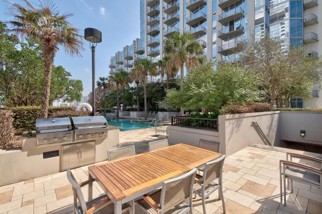 View of patio / terrace featuring outdoor dining area and a community pool | Image 23