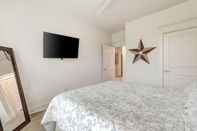 Bedroom featuring light wood-type flooring and baseboards | Image 22