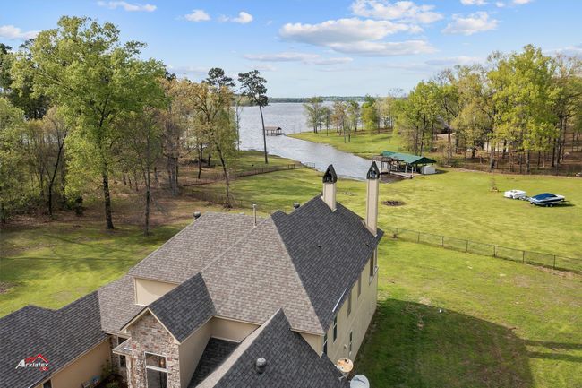 Overhead view of home and lake. | Image 15