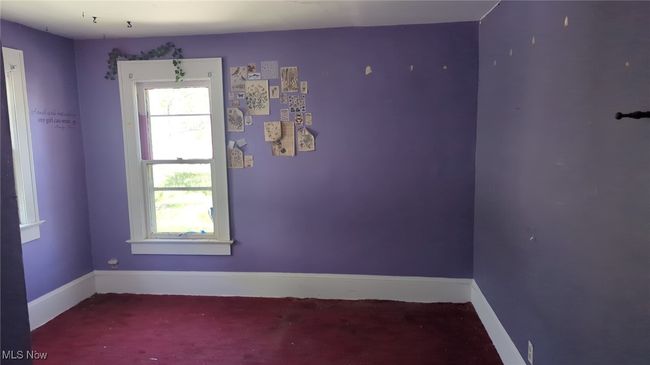 Spare room featuring baseboards | Image 8