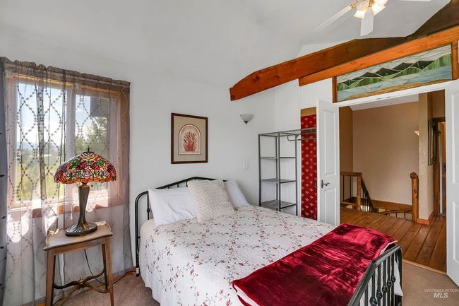 Carpeted bedroom featuring lofted ceiling and ceiling fan | Image 28