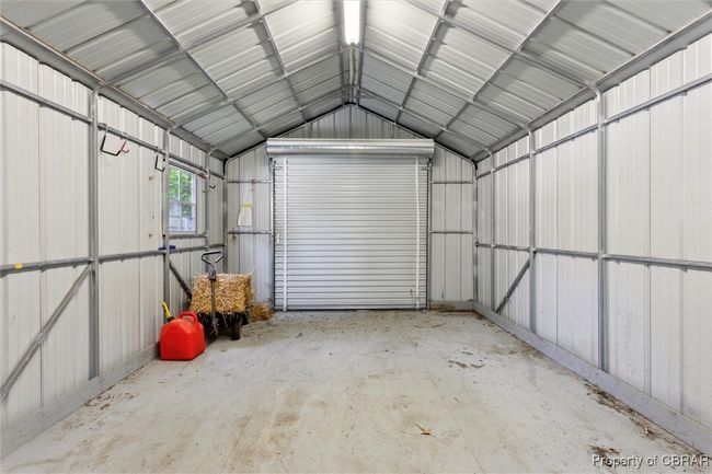 Garage featuring metal wall | Image 37