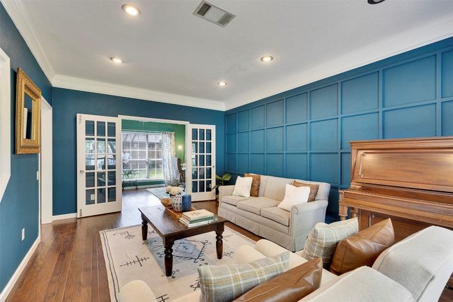 Living room featuring crown molding, baseboards, french doors, recessed lighting, and dark wood-type flooring | Image 15