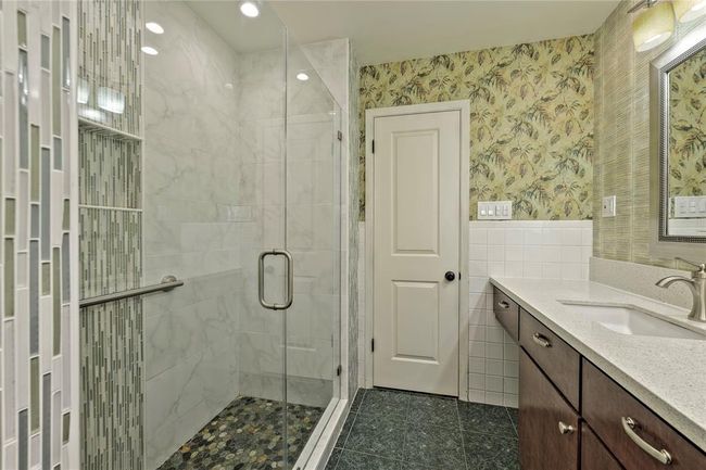 Large Shower and custom cabinets with Quartz Countertops and dual sinks | Image 16
