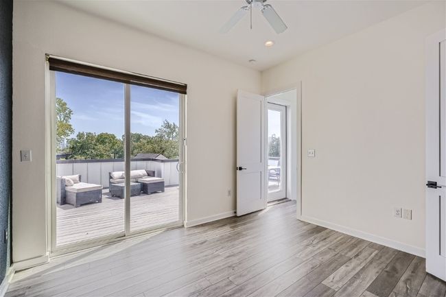 The primary suite is located on the upper level with direct access to the balcony and a gorgeous ensuite bath. | Image 29
