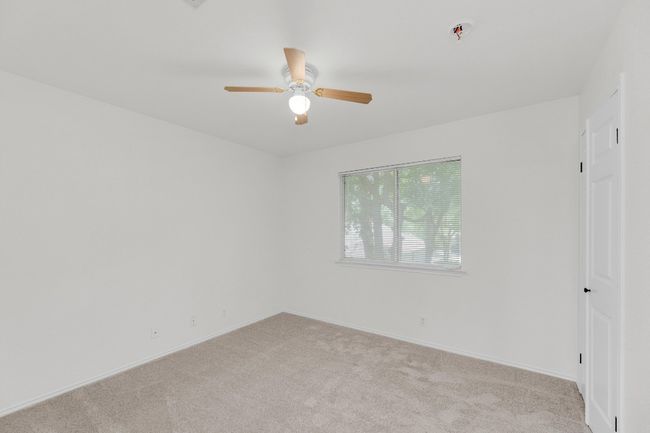 Unfurnished room with ceiling fan, carpet floors, and baseboards | Image 25