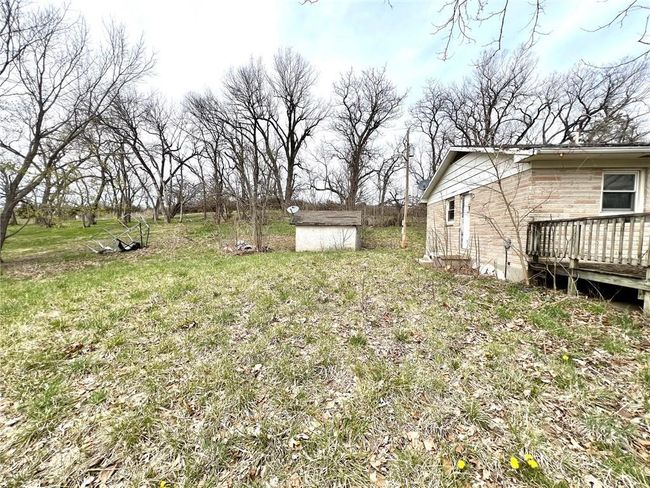 View of yard with a wooden deck | Image 4