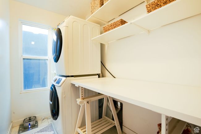 Laundry room with stacked washer and space for folding or storage. Washer and dryer and table not included. | Image 28