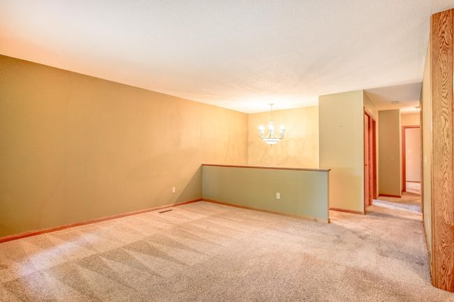 Versatile open layout with elegant lighting and seamless flow from the living area to the bedrooms and bathroom. | Image 8