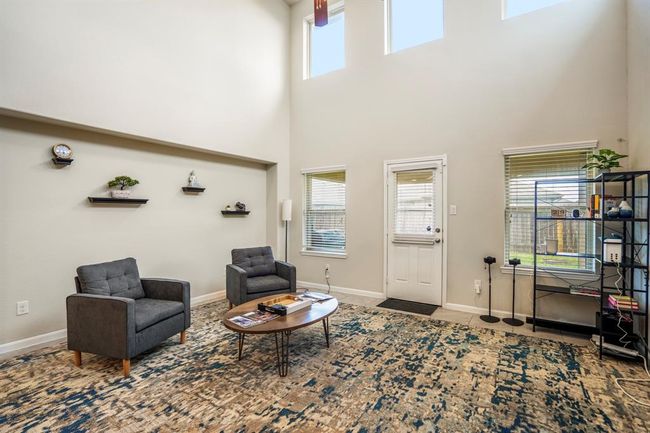 There is a door leading out onto the patio. | Image 18