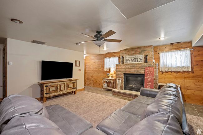 Basement family room with gas fireplace | Image 19