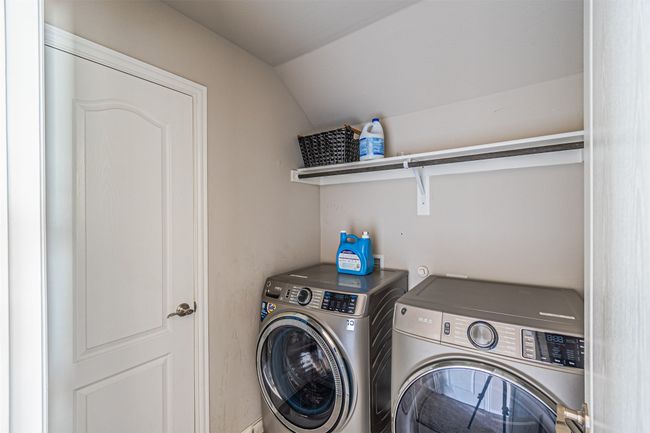 Laundry room with washing machine and clothes dryer | Image 29
