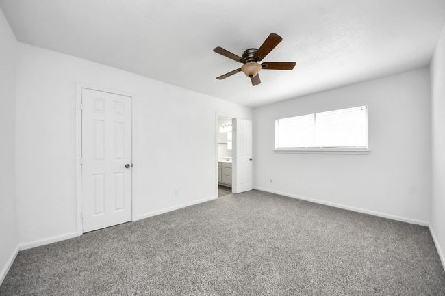 Primary Bedroom with walk-in closet and new carpet | Image 18