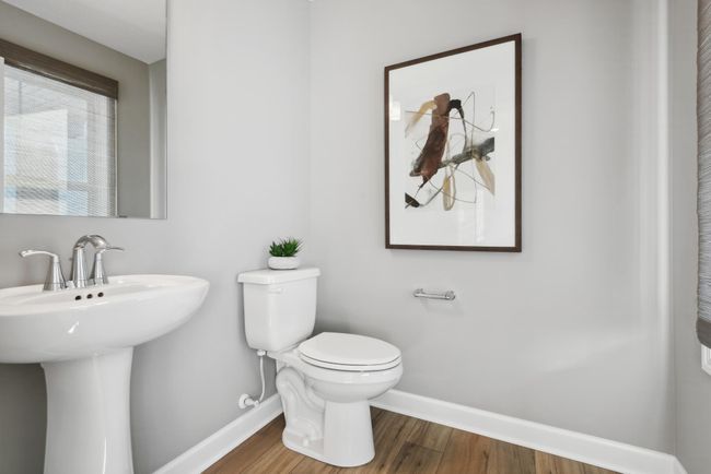 *Photo of model home, actual features may vary. A powder room is conveniently located at the front of the home. | Image 7