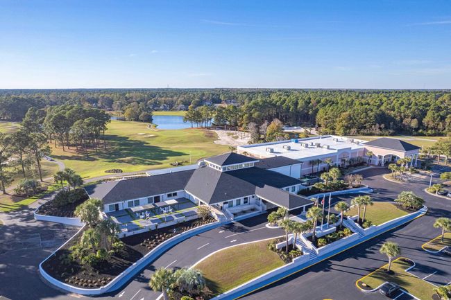 Drone / aerial view featuring a view of trees, view of golf course, and a water view | Image 38