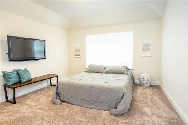 Carpeted bedroom with baseboards | Image 26