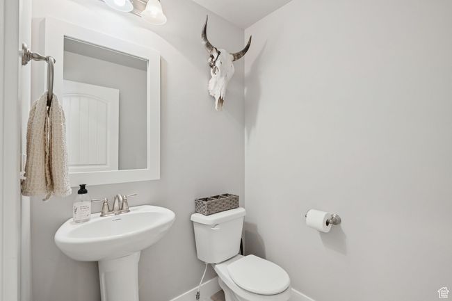 Bathroom with toilet and baseboards | Image 14