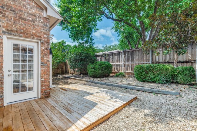 Wooden deck featuring a fenced backyard | Image 24