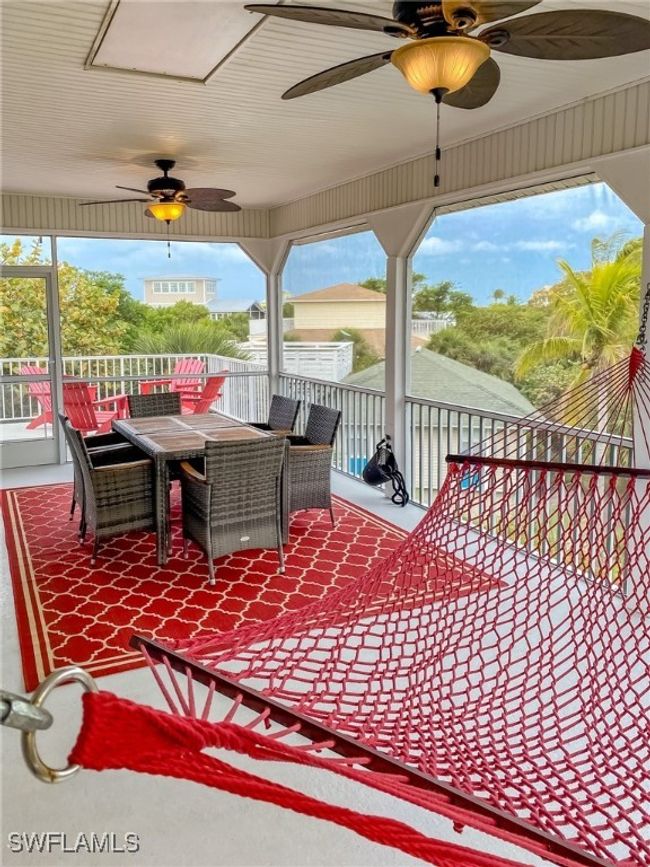 Wooden deck featuring ceiling fan and outdoor dining space | Image 27