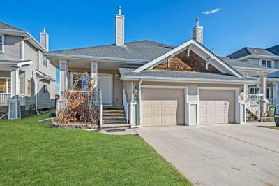 150 Cougartown Cir Sw, Home with 3 bedrooms, 2 bathrooms and 2 parking in Calgary AB | Image 1