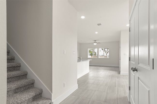 Hallway with recessed lighting, stairs, and baseboards | Image 5