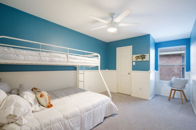 Bedroom with carpet flooring and a ceiling fan | Image 21