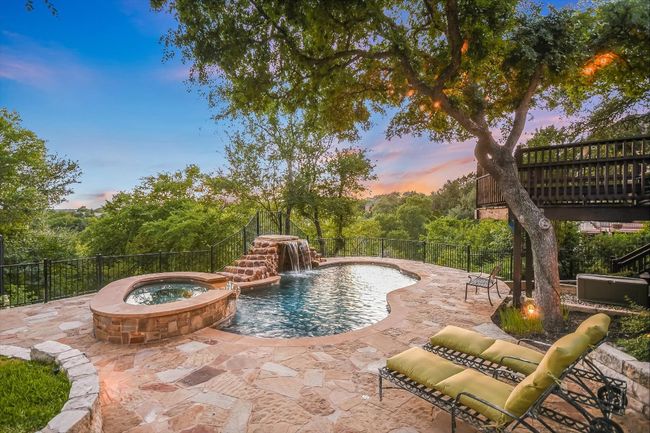 View of pool with a patio area and a pool with connected hot​​‌​​​​‌​​‌‌​‌‌​​​‌‌​​‌‌​‌​​​​​‌ tub/spa. | Image 33