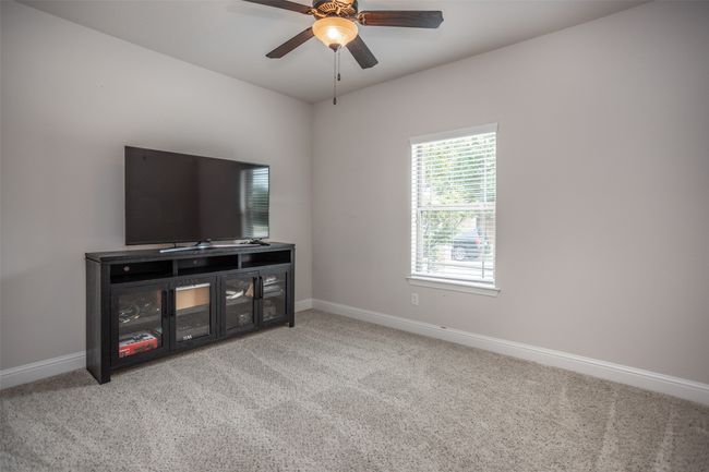 Bedroom featuring carpet and a ceiling fan | Image 35